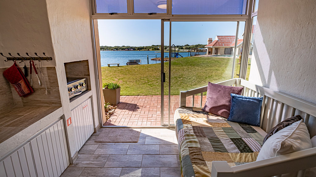 A cozy couch in the braai area of the two bedroom apartment.