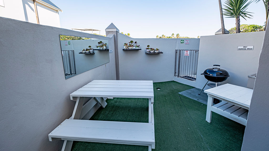 Outside seating area for the Rainbow Apartment.